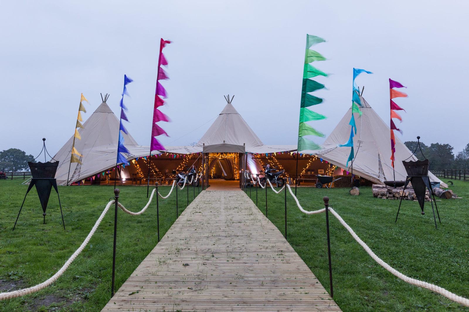 A large event tipi set up on The Great Lawn at Farnham Castle