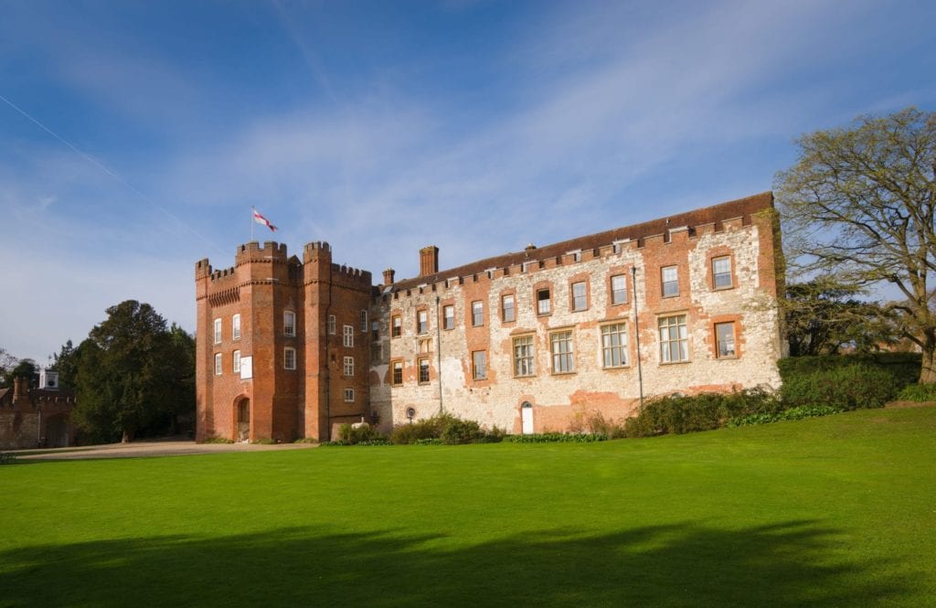 The front of Farnham Castle with the great lawn