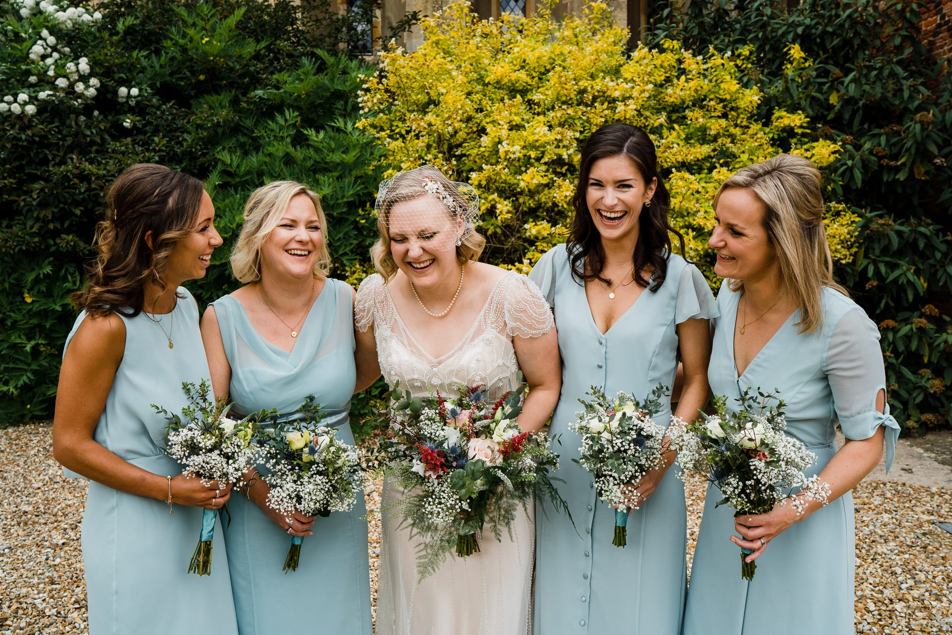 Variety of pale blue bridesmaid dresses
