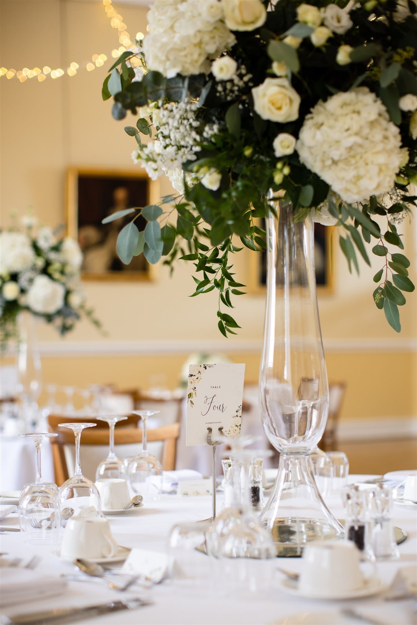 Luxurious wedding reception table decor in white and green
