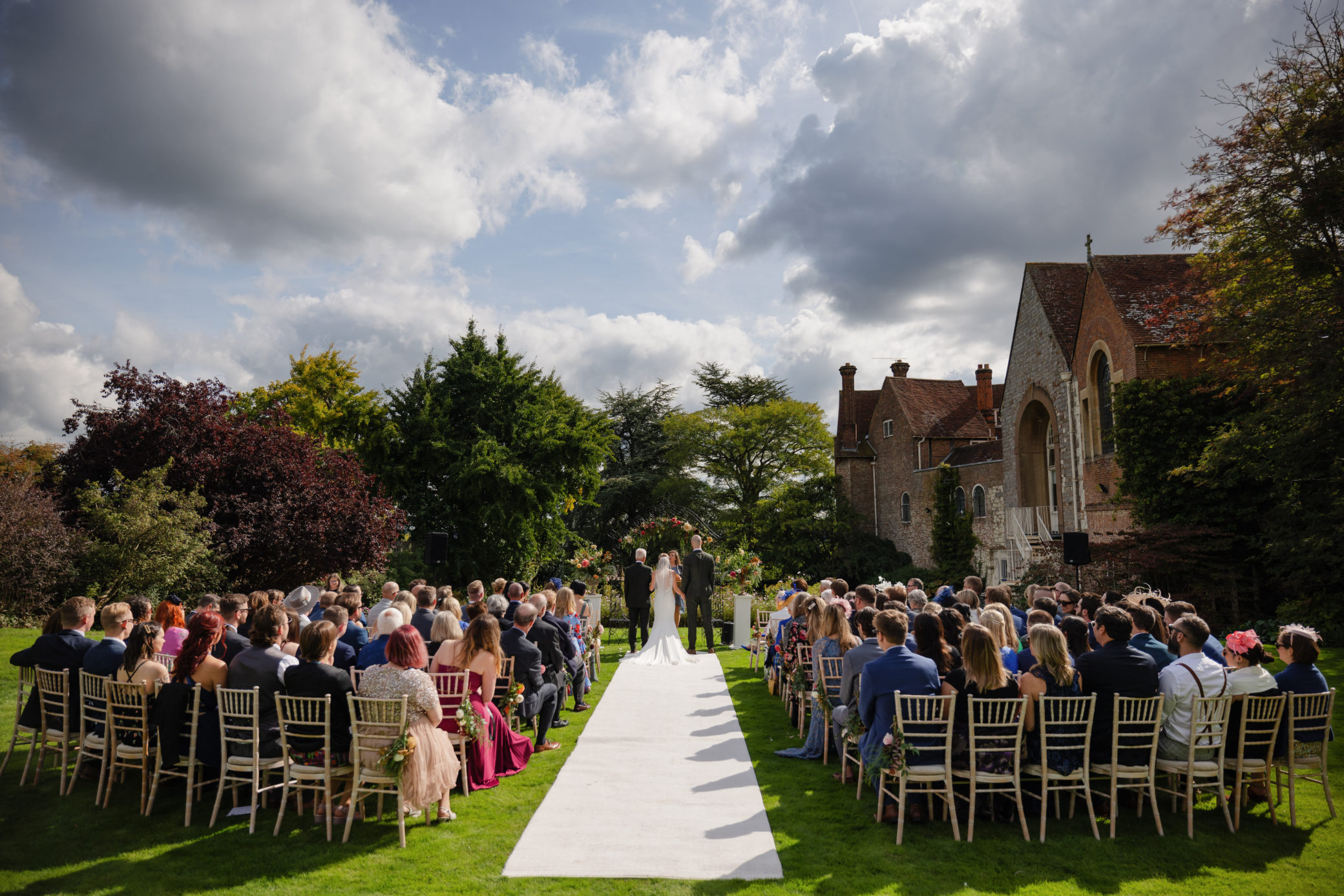Outdoor wedding on the East Lawn at Farnham Castle