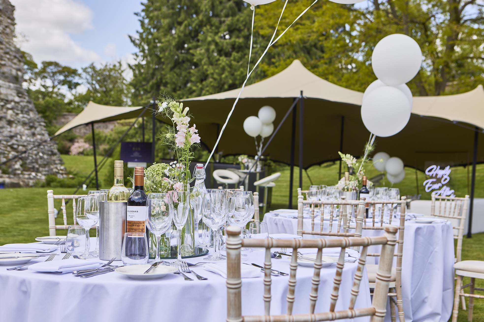 Outdoor wedding celebrations at Farnham Castle in Surrey